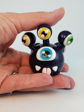 Load image into Gallery viewer, Beholder in White Encased in Transparent Violet
